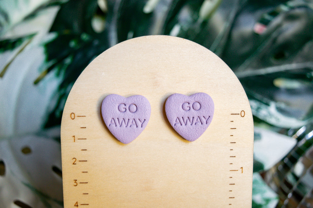 "go away" snarky heart studs