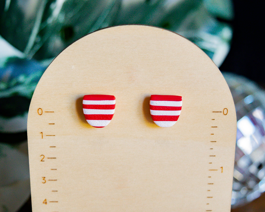 red and white striped studs